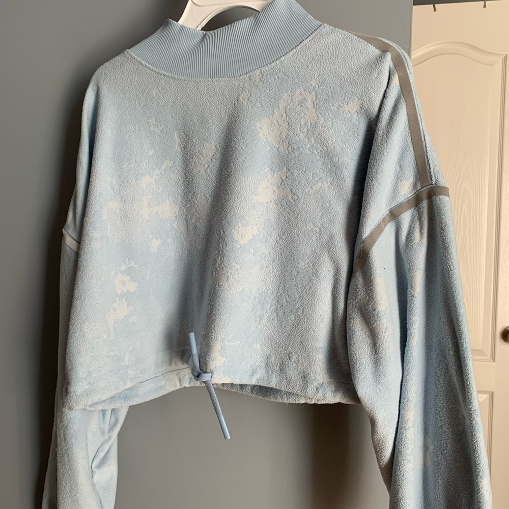 Small, light blue, NIKE, workout cover.